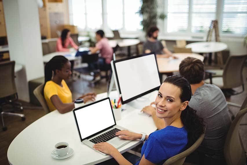 Everything will be awesome. Group of young people in casual clothes working in the modern office
