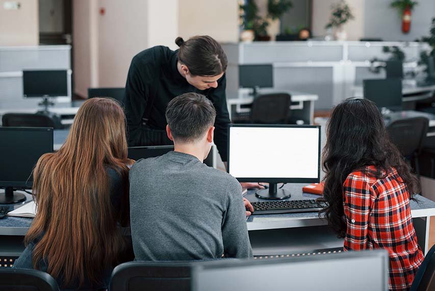 Everything will be awesome. Group of young people in casual clothes working in the modern office