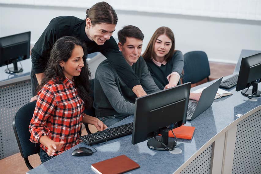 Everything will be awesome. Group of young people in casual clothes working in the modern office
